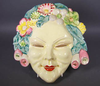 The quaint Clarice Cliff mask, which features in Philips Auctions latest decorative arts sale, first came to public prominence in the Melbourne Herald of November 28, 1935, when it was mentioned in an article about Dr and Mrs Cecil Raphael’s new home high on the hill in Glenferrie Road, Glenferrie. As well as the mask there are several other interesting items in the sale on Sunday March 29 at 47 Glenferrie Road, Malvern. 