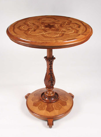 The sale includes this inlaid card table by Anton Seuffert.