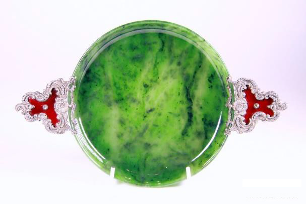 At a packed, standing room only Philips Fine & Decorative Arts auction on 10 September in Melbourne auction, the standout lot was a vibrant green circular Faberge tray with silver gilt and ruby guilloche enamel rococo handles set with cut diamonds; formerly from the John Traina collection. 