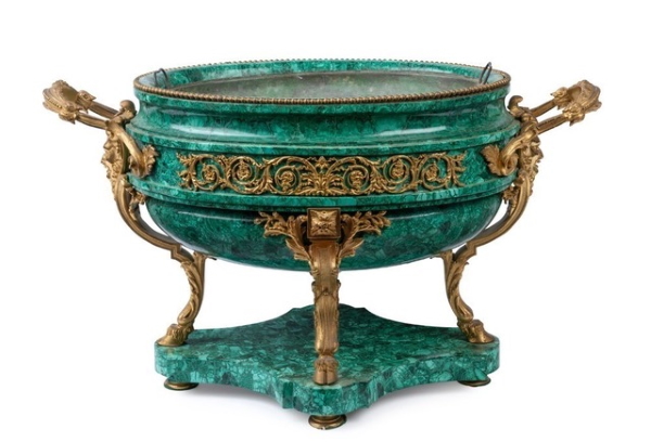 The sale of the Estate of Décor Corporation Pty. Ltd. founder Brian Davis included a superb 19th century French wine cooler of carved malachite with ornate ormolu mounts, adorned with face masks and hoof supports, and fretted foliate mounts to sides. Most likely made for the Russian market, it was estimated at $6,000-8,000 but sold for $35,850. 