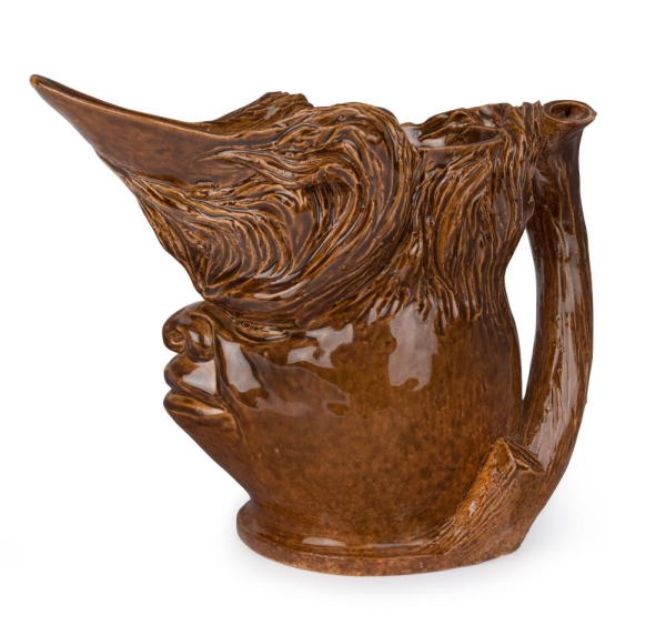 The sale includes this rare William Ricketts character jug from the John Stephens Collection, in brown high gloss glaze incised 'W. M. Ricketts, Melbourne, 1934' estimated at $2,500-3,500